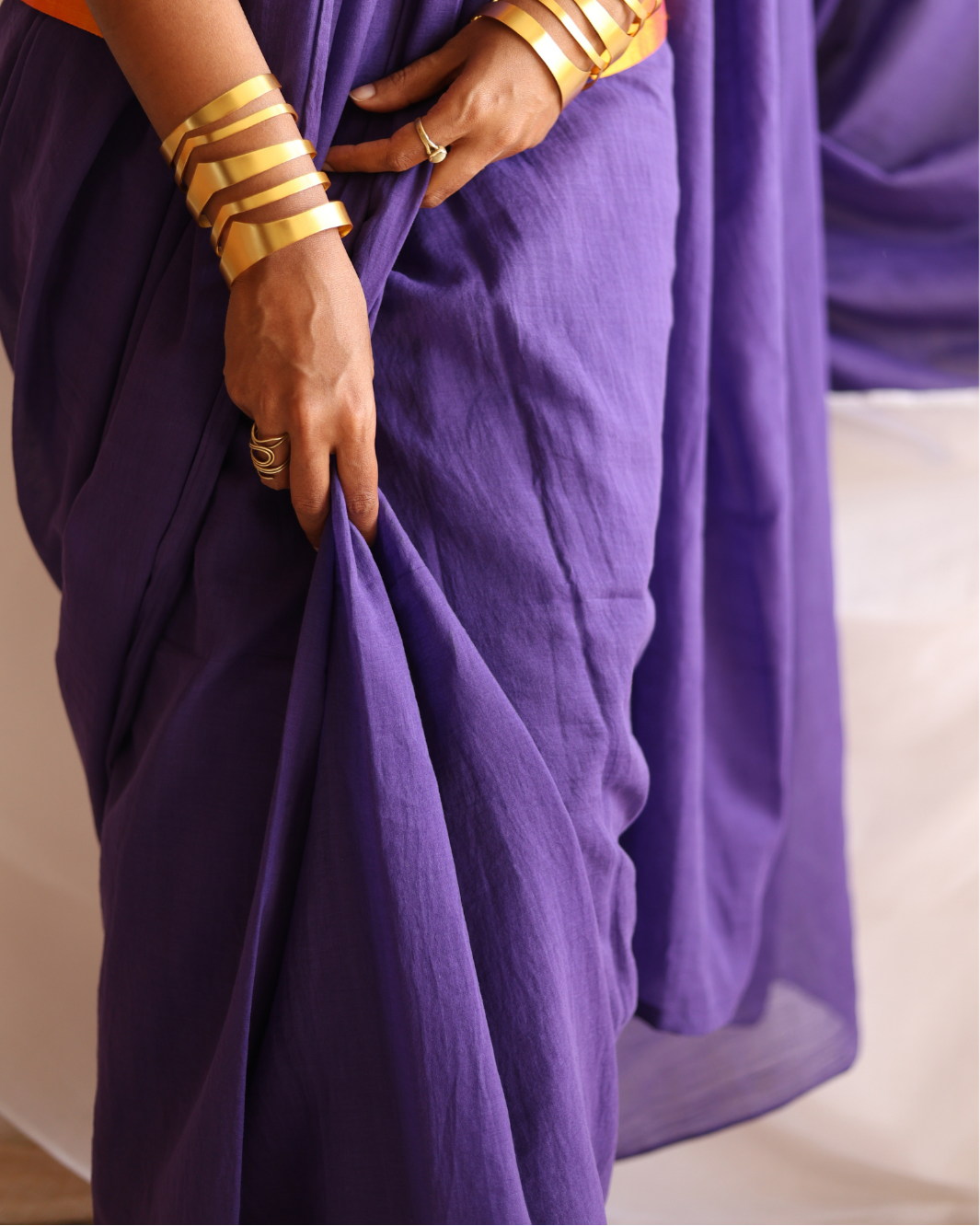 Close-up of the Galaxy deep purple handloom cotton saree, highlighting its soft texture, fluid drape, and artisanal weave. Handwoven by skilled craftsmen, this lightweight saree blends traditional craftsmanship with modern elegance, perfect for everyday wear or special occasions.