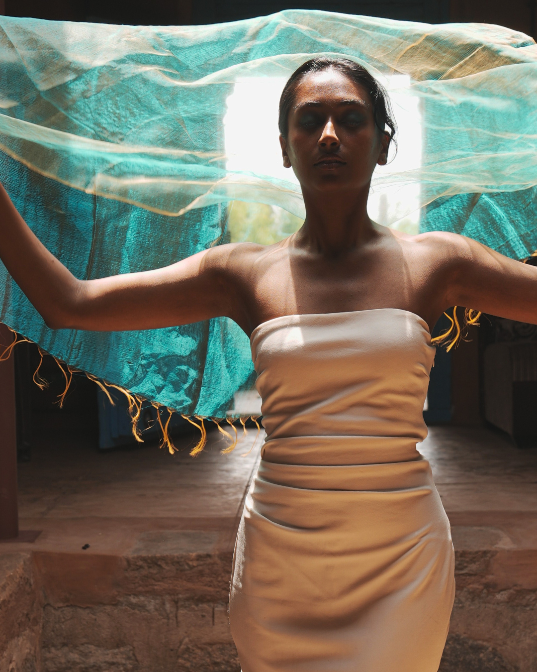 Model wearing a Sunburst Green handwoven silk scarf made using traditional Bengal weaving techniques, highlighting its soft texture, lightweight drape, and natural flow — a handcrafted accessory that blends artisanal heritage with modern everyday style.